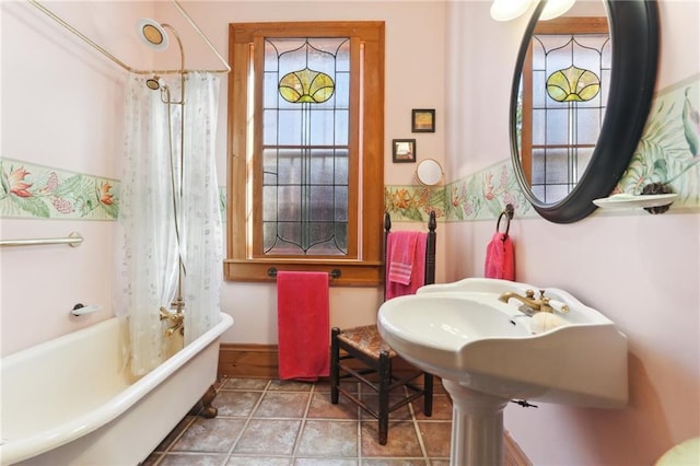 bathroom with tile patterned flooring and shower / tub combo