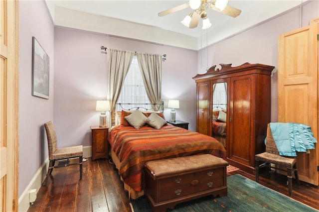 bedroom featuring dark wood-type flooring and ceiling fan