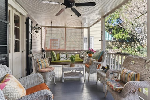 sunroom / solarium with ceiling fan