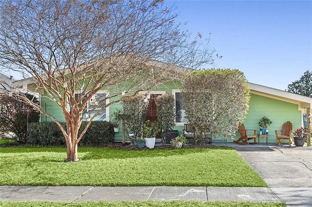 obstructed view of property with a front yard