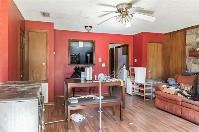 interior space featuring ceiling fan and wood-type flooring