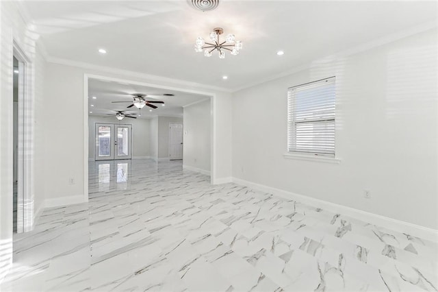 empty room with ceiling fan with notable chandelier, ornamental molding, and french doors