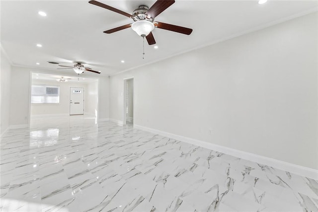 empty room featuring ceiling fan and crown molding