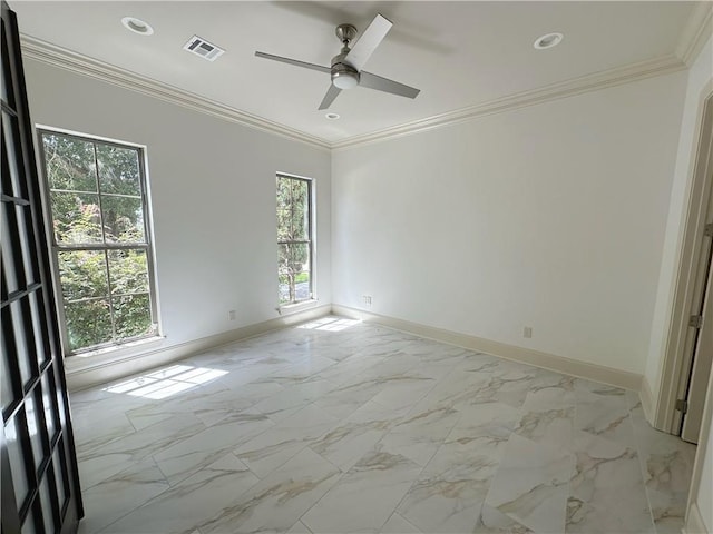 unfurnished room with ceiling fan and ornamental molding