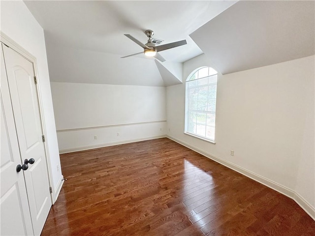 additional living space with dark wood-type flooring, ceiling fan, and lofted ceiling