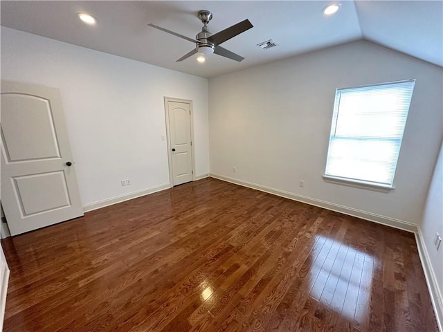 unfurnished room with dark hardwood / wood-style floors, ceiling fan, and vaulted ceiling