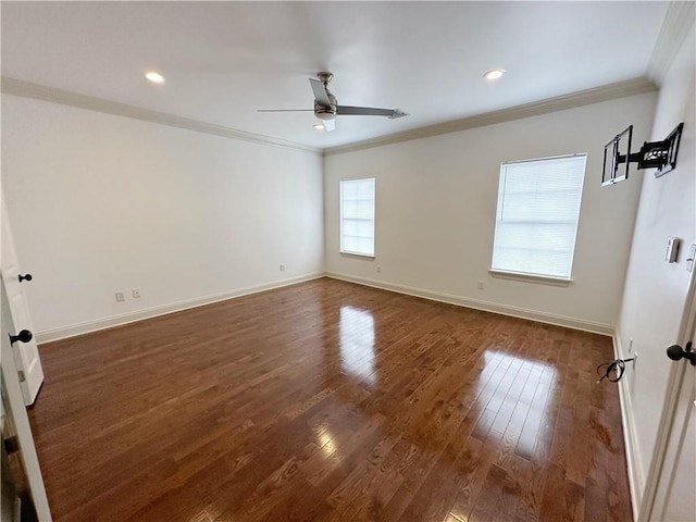 spare room with dark wood-type flooring, ceiling fan, and ornamental molding