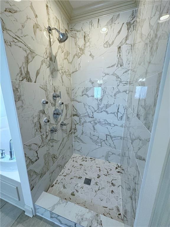 bathroom with a tile shower