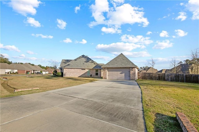 view of front of property featuring a garage and a front lawn