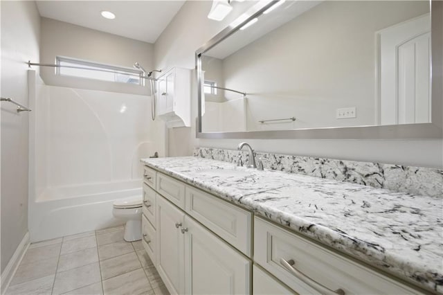 524 Belle Pointe Loop, Madisonville, LA 70447 - bathroom featuring vanity, washtub / shower combination, toilet, tile patterned flooring, and baseboards