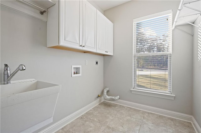 laundry room featuring sink, electric dryer hookup, hookup for a washing machine, cabinets, and hookup for a gas dryer