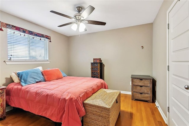 bedroom featuring hardwood / wood-style floors and ceiling fan