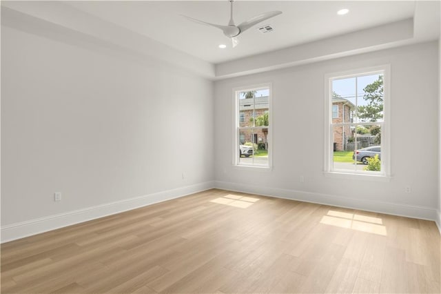 unfurnished room with ceiling fan and light hardwood / wood-style flooring