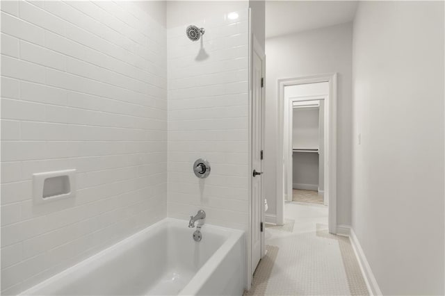 bathroom with tile patterned floors and tiled shower / bath