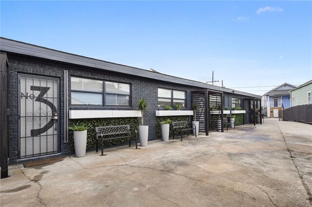 view of side of home with a patio