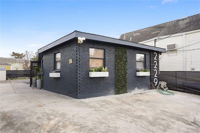 view of side of home featuring a patio area