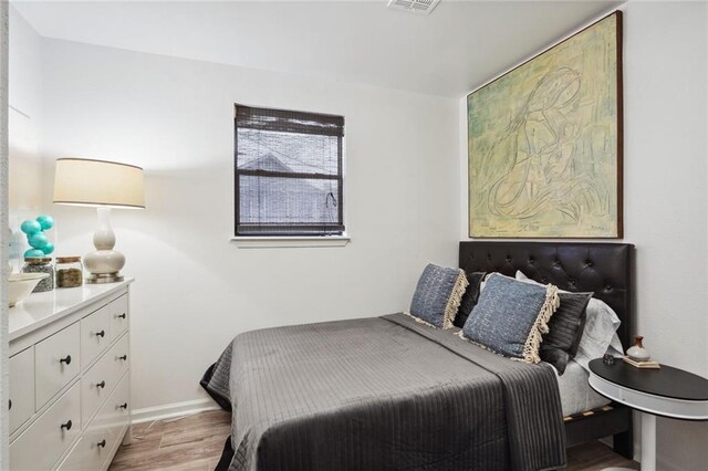 bedroom with light hardwood / wood-style flooring