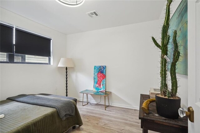 bedroom with light wood-type flooring