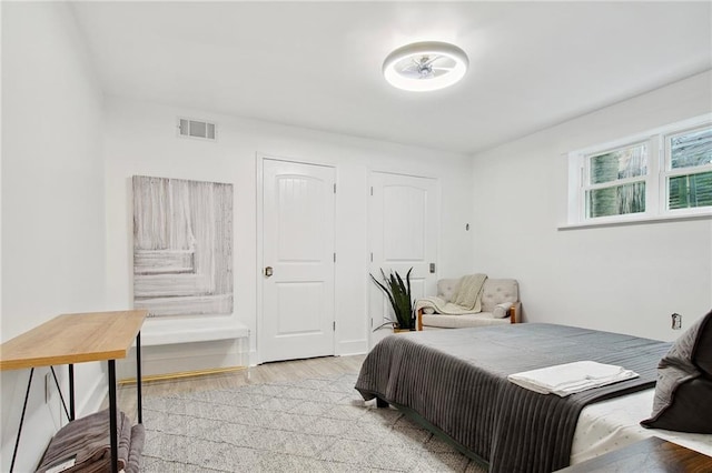 2604 Chartres St, New Orleans, LA 70130 - bedroom with light wood-style flooring
