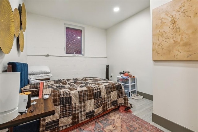 bedroom with hardwood / wood-style flooring