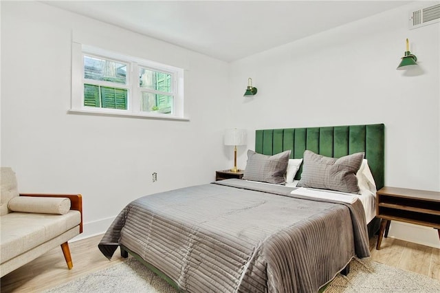 bedroom with light hardwood / wood-style flooring