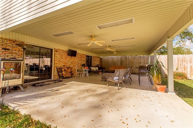 view of patio featuring ceiling fan