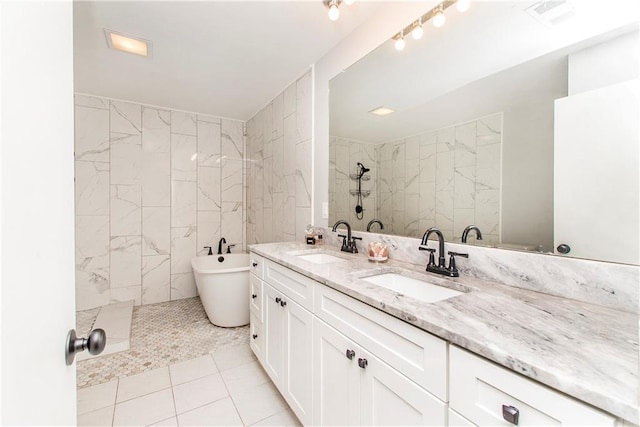 bathroom with tile patterned floors, separate shower and tub, and vanity