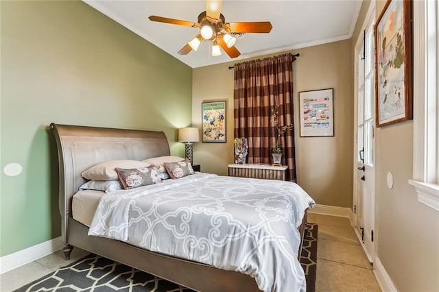 tiled bedroom featuring ceiling fan