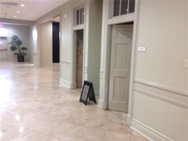 1205 St Charles Ave Unit 916, New Orleans, LA 70130 - corridor featuring light marble finish floors and a drop ceiling