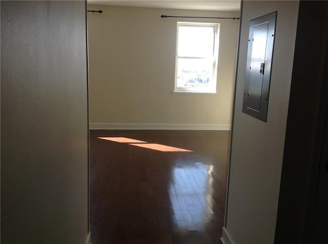 1205 St Charles Ave Unit 916, New Orleans, LA 70130 - empty room featuring dark wood-style flooring and electric panel