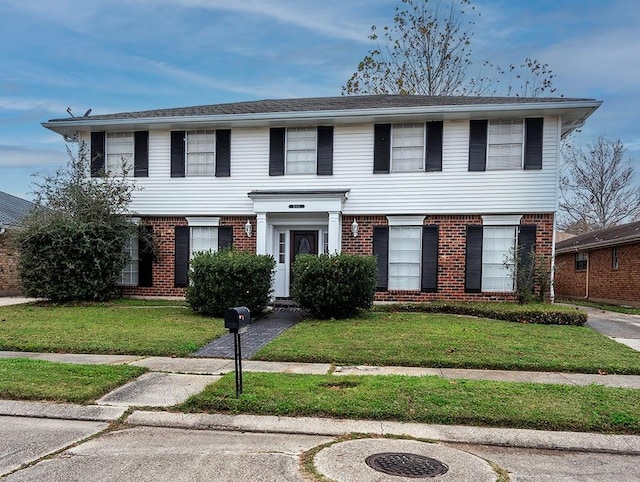 view of front of property with a front lawn