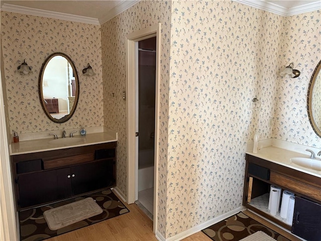 10923 Chaucer St, New Orleans, LA 70127 - bathroom with crown molding, wallpapered walls, vanity, and wood finished floors
