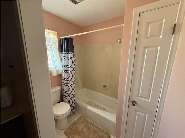 10923 Chaucer St, New Orleans, LA 70127 - bathroom featuring tile patterned floors, shower / bath combination with curtain, and a textured ceiling