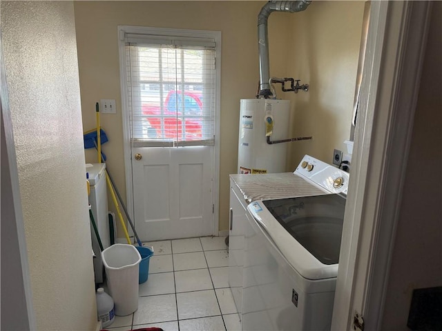 10923 Chaucer St, New Orleans, LA 70127 - laundry room with water heater, independent washer and dryer, and light tile patterned floors