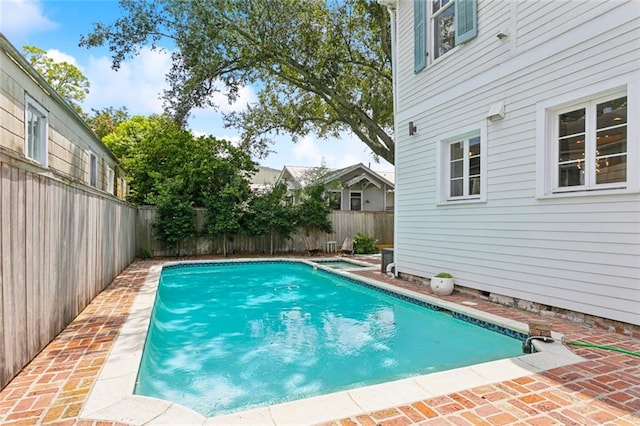 view of pool featuring a patio