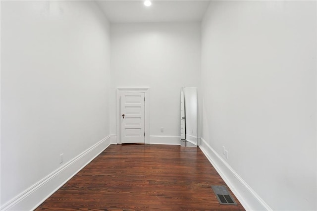 spare room featuring dark hardwood / wood-style flooring