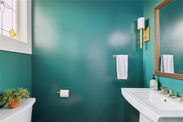 bathroom featuring sink and toilet