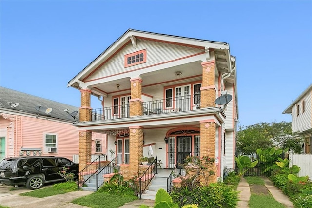 view of front of home with a balcony and a porch