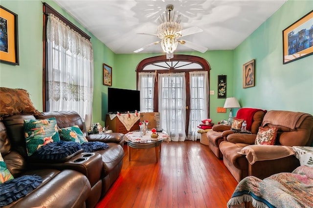 living room featuring ceiling fan and wood-type flooring