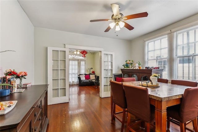 dining area with french doors, dark hardwood / wood-style floors, and ceiling fan