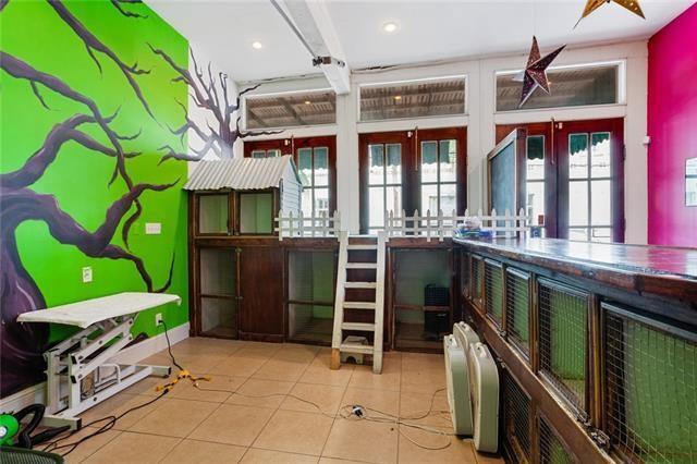 interior space with french doors and light tile patterned flooring