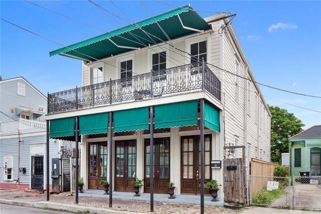 1027 Ninth St, New Orleans, LA 70115 - view of front facade with a gate, french doors, and a balcony
