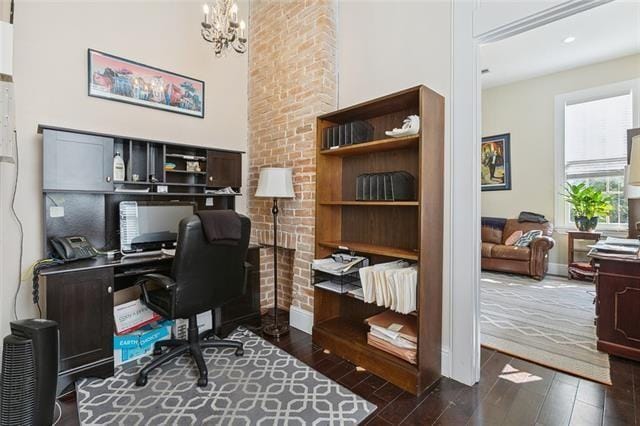 1027 Ninth St, New Orleans, LA 70115 - home office featuring dark wood finished floors and a chandelier