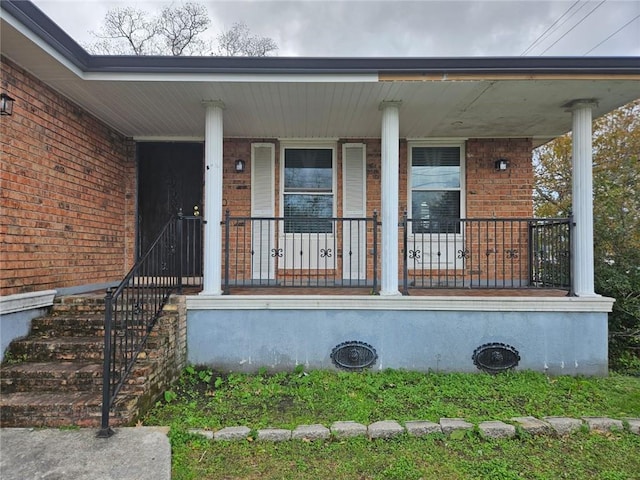 doorway to property with a porch