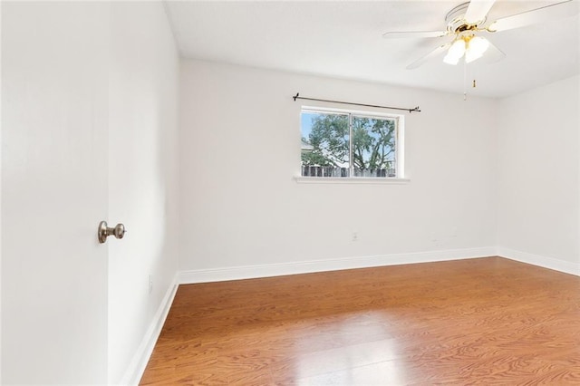 spare room featuring ceiling fan and wood-type flooring