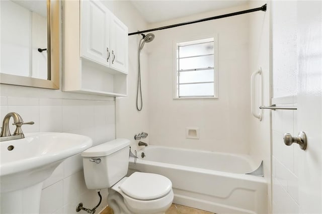 full bathroom featuring toilet, tile walls, tasteful backsplash, and shower / tub combination