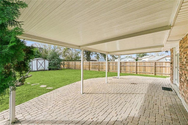 view of patio featuring a storage shed