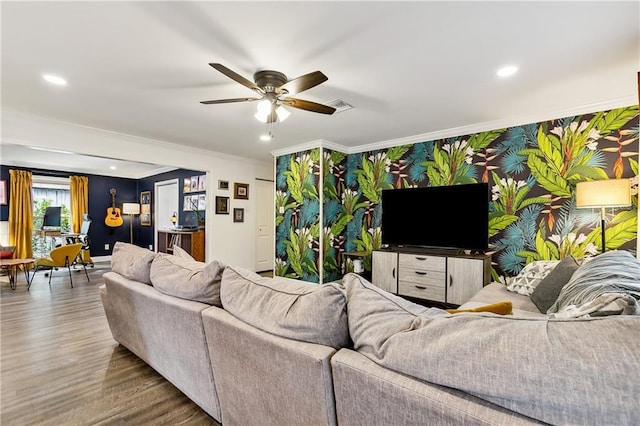 living room with ceiling fan, crown molding, and wood-type flooring