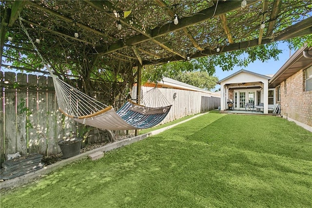 view of yard with french doors