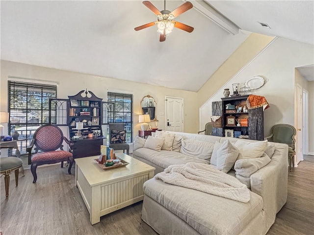 living room with hardwood / wood-style floors, lofted ceiling with beams, ceiling fan, and plenty of natural light